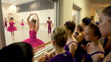 Level six students from the Australian ballet watch level 8 graduating students rehearsing Black Swan Pas De Leux in training.