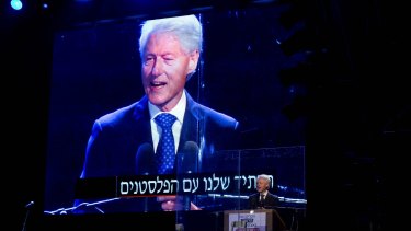 Former US President Bill Clinton speaks during a rally marking 20 years since the assassination of the late Israeli Prime Minister Yitzhak Rabin.