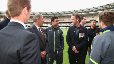 Ed Cowan of Australia meets Australian War Veterans during Remembrance Day on day three of the First Test match between Australia and South Africa at The Gabba on November 11, 2012 in Brisbane, Australia.