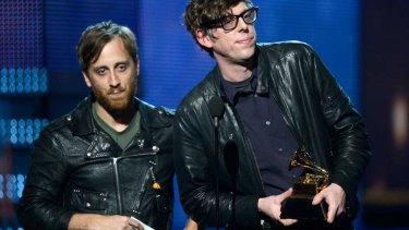 Black Keys' Dan Auerbach, left, and Patrick Carney accepting best rock performance for <i>Lonely Boy</i> at the Grammys.