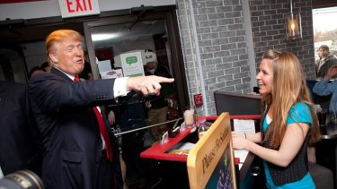 Donald Trump is greeted by hostess, Haylee Shrimpton, 19, as he arrives at the Roundabout Diner in Portsmouth, New Hampshire.