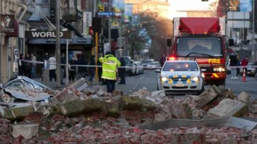 Rubble from a damaged building lies on the street following a 7.1-magnitude earthquake in central Christchurch.