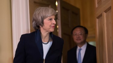 British Prime Minister Theresa May welcomes State Councillor of the People's Republic of China Yang Jiechi to 10 Downing Street on December 20.