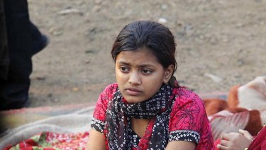 Rubina Ali sits amid the ruins of the Gharib Nagar slum in Mumbai.
