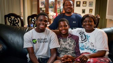 Clockwise from top, the Tiafoe family. Francis Sr., Alphina, Franklin and Francis at their apartment.