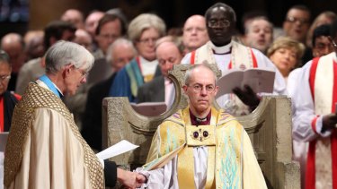 The Most Reverend Justin Welby sits in the Chair of St Augustine during his enthronement as the Archbishop of Canterbury.