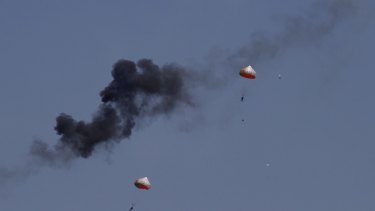 Pilots from Indonesia's Jupiter aerobatics team eject after a mid-air collision during a practice session over Langkawi.