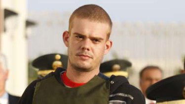 Dutch citizen Joran Van der Sloot is escorted by police officers outside a Peruvian police station.
