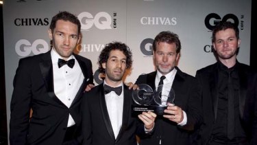 Members of the Blue Tongue Films group pose with the award for Creative Force of the Year at the 2010 GQ Men of The Year Awards, 2010.