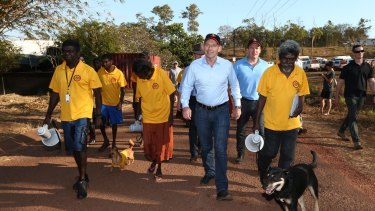 Prime Minister Tony Abbott with school attendance officers in Yirrkala during his visit to North East Arnhem Land in 2014.