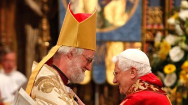 The Pope and the Archbishop of Canterbury embrace.