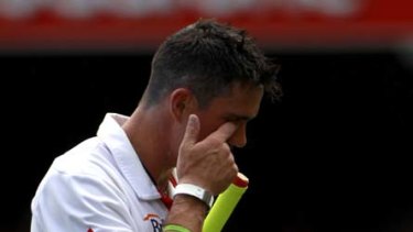 England's Kevin Pietersen wipes his eye after he was caught out for 43.