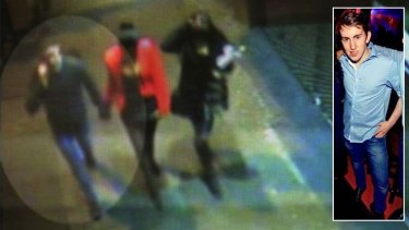 The last image ...  A CCTV image of Thomas Kelly talking on his phone as he holds the hand of his new girlfriend, shortly before the attack.