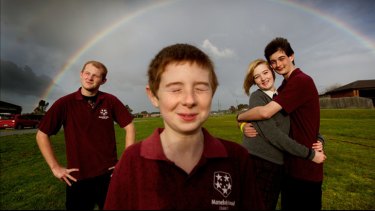 Charlotte Lampard, 16, helps care for her intellectually disabled brothers Jacob, 17, Ben, 11, and Lachlan, 14.