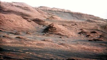 The base of Mars' Mount Sharp -  the rover's destination  -  is pictured in this August 27, 2012 NASA photo taken by the Curiosity rover. The image is a portion of a larger image taken by Curiosity's 100-millimeter Mast Camera on August 23. Scientists enhanced the colour to show the Martian scene under the lighting conditions we have on Earth, which helps in analysing the terrain.