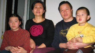 Gao Zhisheng, second right, his son Gao Tianyu, right, wife Geng He, second left, and daughter Geng Ge, left, at their home in Beijing in 2006.