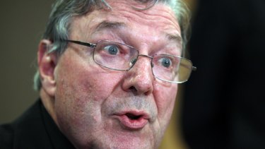 Cardinal George Pell faces the media at a press conference on Tuesday.