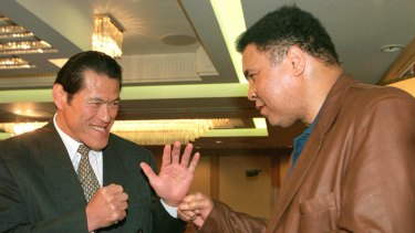 Reunion: Antonio Inoki, left, and Muhammad Ali meet again in Tokyo in 1998.