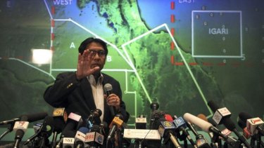 Under pressure ... Malaysia's Department of Civil Aviation's Director General Azharuddin Abdul Rahman briefs reporters on search and recovery efforts within existing and new areas for the missing Malaysia Airlines plane during a press conference in Sepang, Malaysia.