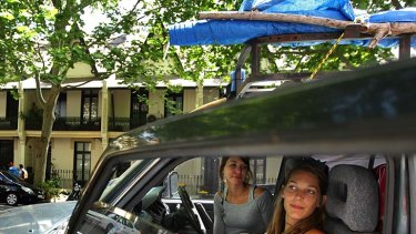 Shutting up shop &#8230; French backpackers Enora Wolf and Charline Nanot in the four-wheel drive they're trying to sell parked on Victoria Street. They bought it three months ago from the same spot.