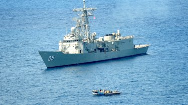 HMAS Melbourne approaches the Somali pirate vessel in the Indian Ocean.