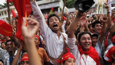 Supporters celebrate as results are announced at Aung San Suu Kyi's National League for Democracy head office in Yangon.