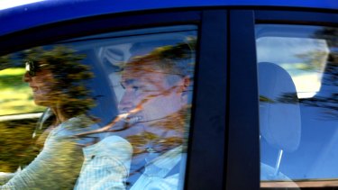 Craig Thomson with girlfriend Zoe Arthur leaving their house at Bateau Bay this morning.