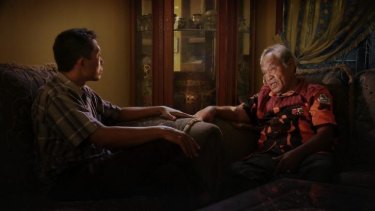 Adi Rukun confronts Amir Siahaan in <i>The Look of Silence</i>.