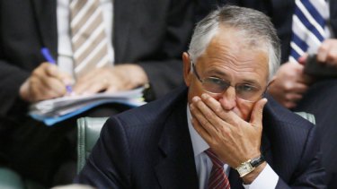 Opposition Leader Malcolm Turnbull listens to Prime Minister Kevin Rudd during Question Time.