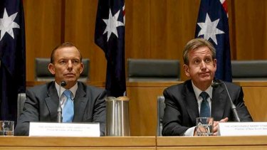 Prime Minister Tony Abbott with NSW Premier Barry O'Farrell during the COAG press conference at Parliament House in Canberra.