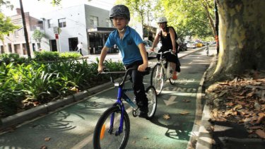 Safe conduit: A family on the cycle way on Sydney's Bourke Street.