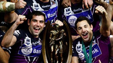 Storm’s Cameron Smith and Billy Slater celebrate last year’s NRL grand final win.