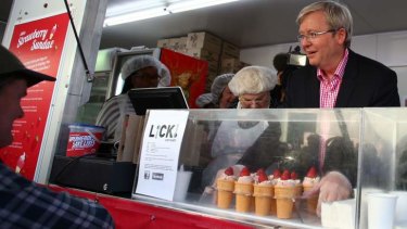 The big sell: Kevin Rudd makes strawberry sundaes at the Ekka on the Queensland campaign trail.