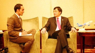 Contacts: Garnaut with Tan Wan'geng, president of China Southern Airlines.