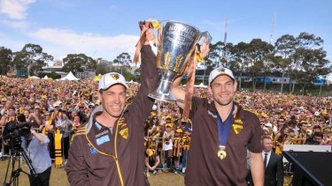 Hawthorn coach Alistair Clarkson and captain Luke Hodge with the premiership cup at Glenferrie oval.