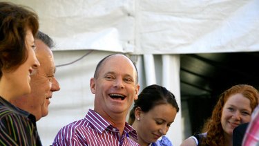 Campbell Newman has a laugh with fellow MPs and the media.