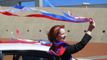 Julia Gillard shows her true colours outside Parliament House, on the eve of the Bulldogs' showdown with St Kilda.