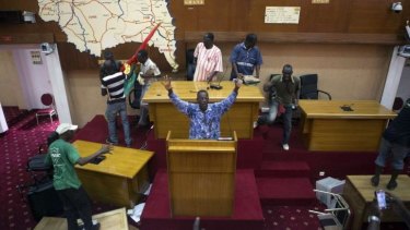 Taking control: Protesters inside the Burkina Faso parliament.