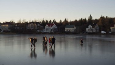 Showing some elf-respect: Teenagers on a frozen lake in Iceland?s capital, Reykjavik.