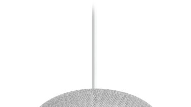 The Google Home Mini features touch-sensitive controls under the cloth cover.