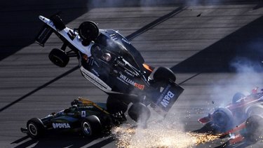 Sparks shoot out as Dan Wheldon's car launches into the air during the crash.