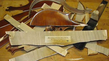 A picture the buyer of a violin sent to the selller, showing they had destroyed it.