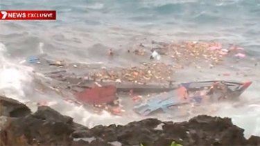 The boat smashed up against the rocks, shown on a video image from Channel 7.