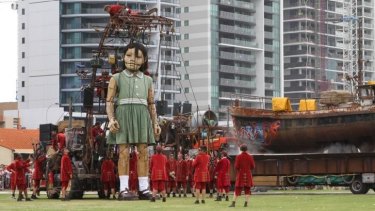 The Little Girl Giant relied on her Lilliputian helpers to help her get dressed.