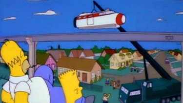 The Simpsons watch on as Springfield's monorail is built.