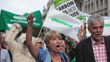 British actress Emma Thompson and John Sauven from Greenpeace join an estimated 40,000 thousand people marching from the Embankment via Whitehall to the Houses of Parliament in London, Sunday, Sept 21, 2014 as part of the People's Climate March, a worldwide mobilisation calling on world leaders to commit to urgent action on climate change and 100% clean energy.