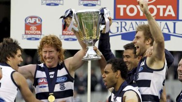 Who's in your team? ... Geelong celebrate their 2011 AFL grand final victory.
