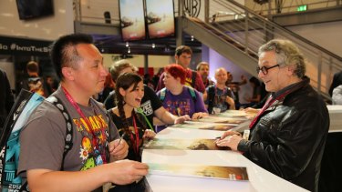 George Miller, of Mad Max: Fury Road, meets fans at Comic-Con.