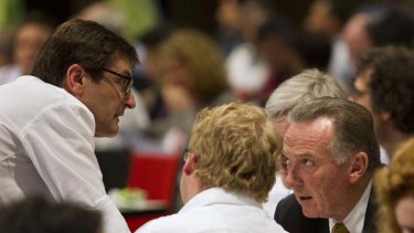 Australia's Minister for Climate Change Greg Combet (left) speaks with Canada's Environment Minister Peter Kent during a break in plenary session at the United Nations Climate Change Conference in Durban.