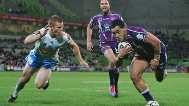 On the run: Melbourne Storm's Mahe Fonua, its first true-blue Victorian talent and playing his first NRL game, makes a dash.